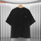 Black short-sleeve shirt with small cross embroidery on the front