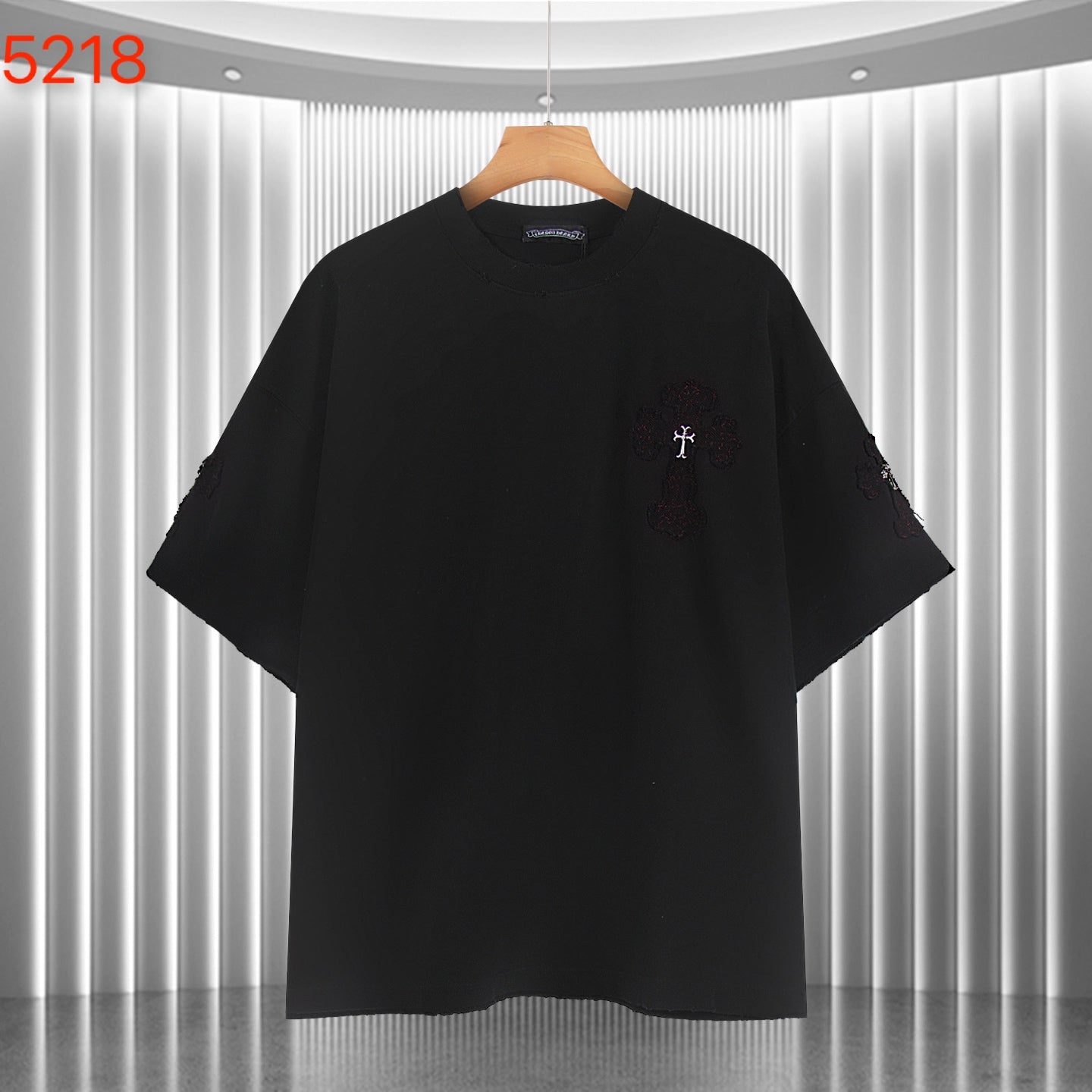 Black short-sleeve shirt with small cross embroidery on the front