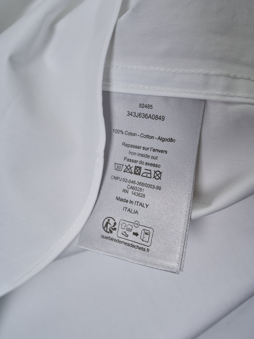Dior white shirt care label inside collar with fabric and washing instructions