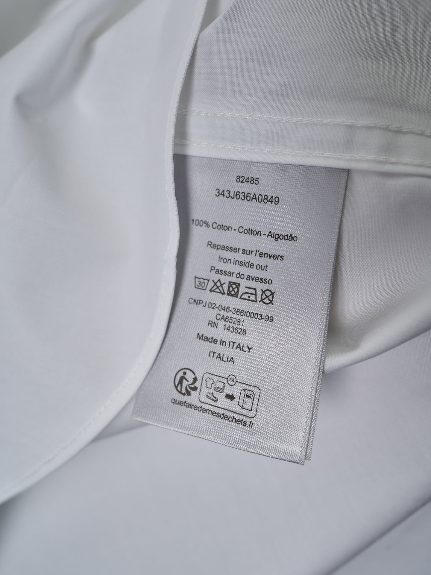 Dior white shirt care label inside collar with fabric and washing instructions