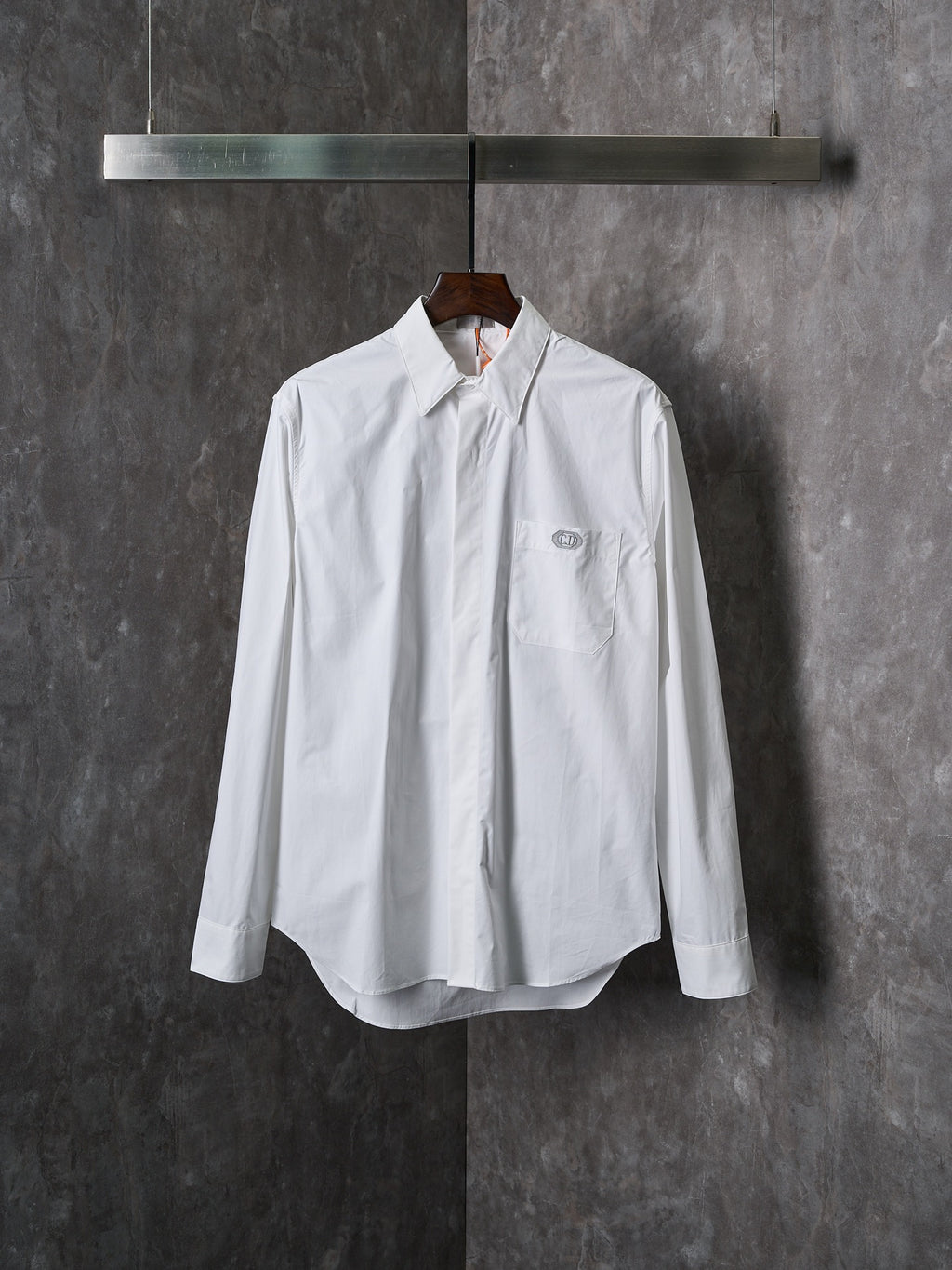 Dior white long-sleeve button-up shirt with pointed collar and front button placket