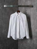 Dior white long-sleeve button-up shirt with pointed collar and front button placket