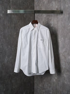 Dior white long-sleeve button-up shirt with pointed collar and front button placket