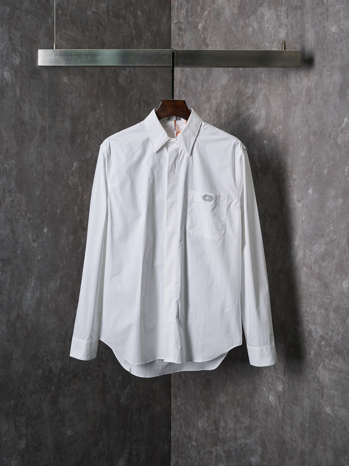 Dior white long-sleeve button-up shirt with pointed collar and front button placket