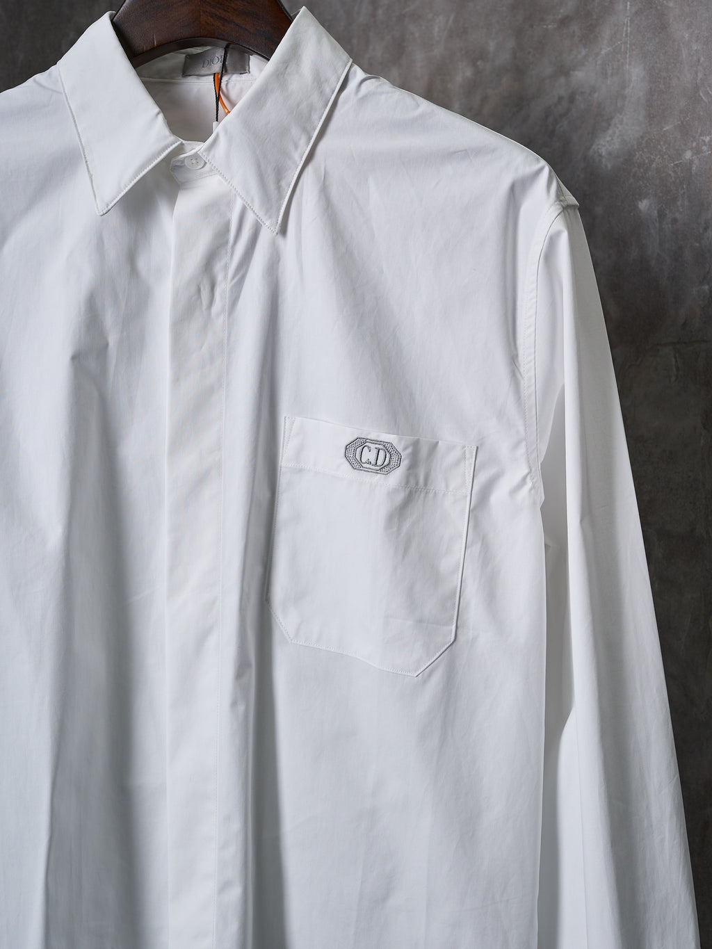 Dior white long-sleeve button-up shirt with chest pocket and small embroidered logo