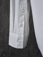 Dior white shirt sleeve cuff with buttoned placket and visible topstitching