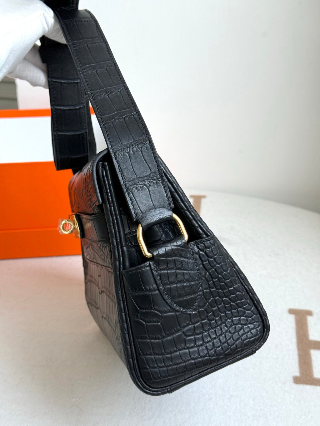 Hermes croc-textured handbag, dark blue, gold buckle and strap hardware detail