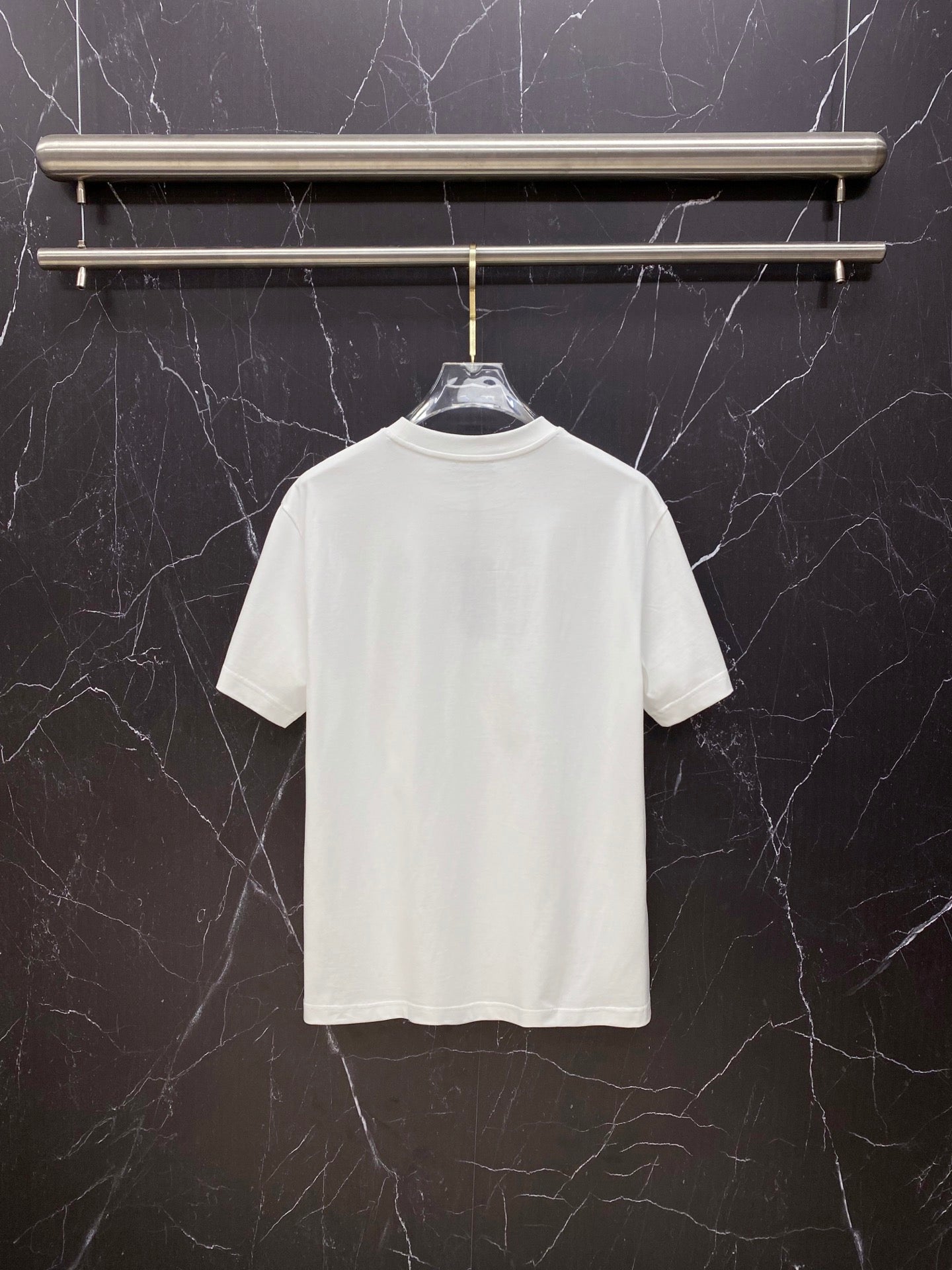 White T-shirt on hanger, crew neck, no visible front print