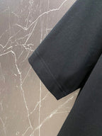 Black Versace T-shirt sleeve cuff close-up