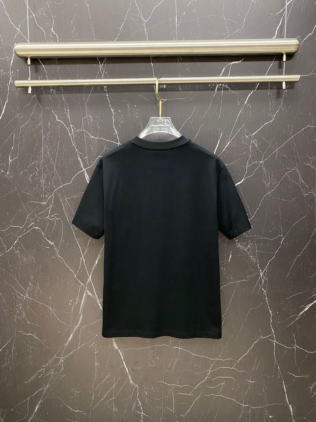 Black Versace T-shirt, back view on hanger