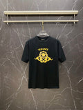 Black Versace T-shirt with gold logo print on chest.