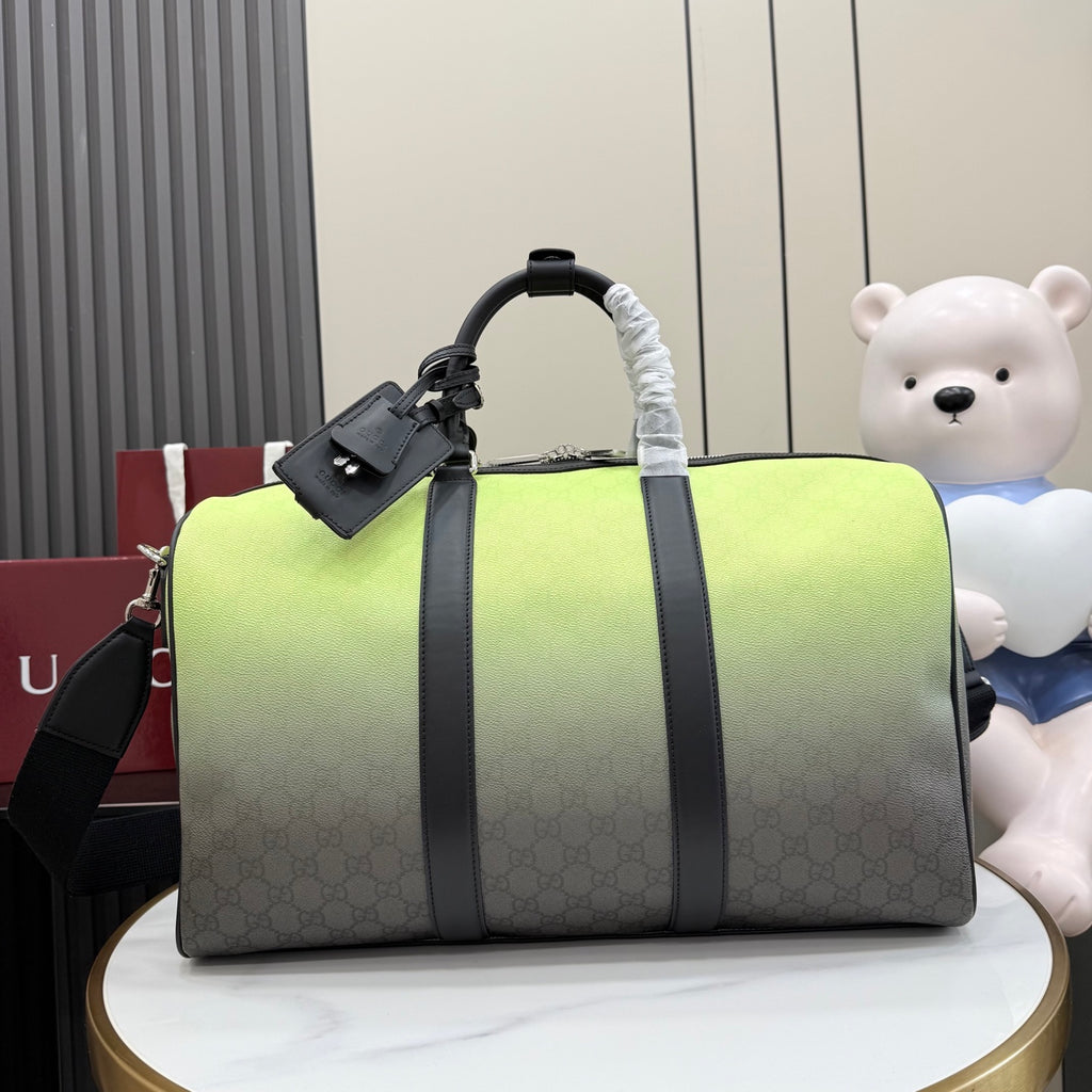 Gucci duffel bag with lime-green top and dark gray monogram body, black handles