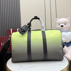 Gucci duffel bag with lime-green top and dark gray monogram body, black handles