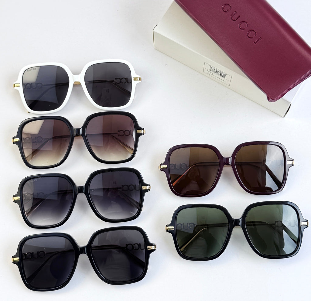 Multiple square sunglasses with assorted frames and tinted lenses on display