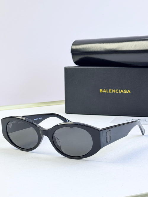 Balenciaga sunglasses with black oval frames and dark lenses