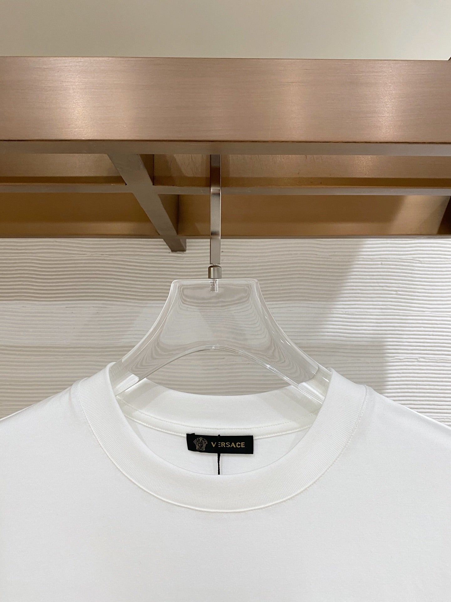 White crewneck T-shirt neckline with inner label detail