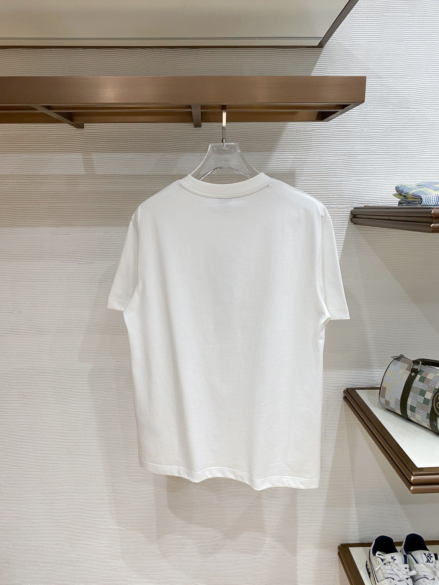 White T-shirt on hanger, plain front with crew neck