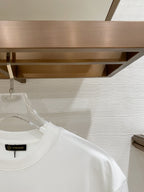 White T-shirt close-up of shoulder and collar with inner label