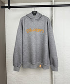 Gray marl hoodie with yellow embroidered script logo, pullover hood, and front pouch pocket