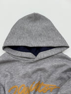 Gray hoodie hood with dark navy lining and yellow embroidered script logo