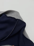 Gray hoodie with dark navy lining along the hood edge and stitched seam