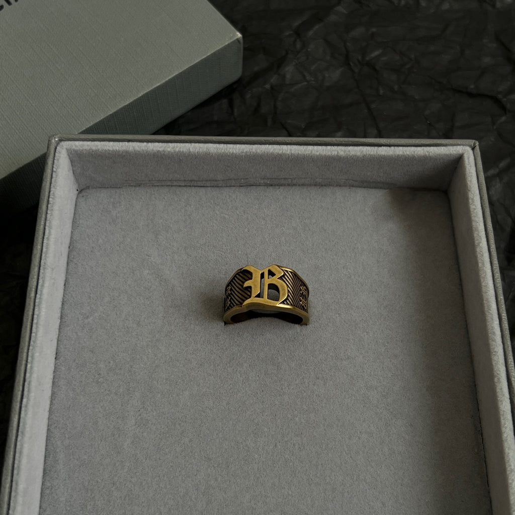 Balenciaga gold-tone crest ring in box, centered view