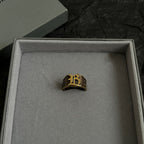 Balenciaga gold-tone crest ring in box, centered view
