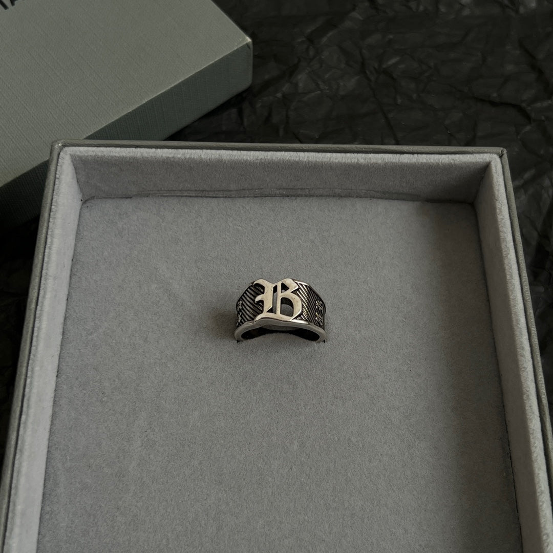 Silver-tone logo ring centered in open gift box