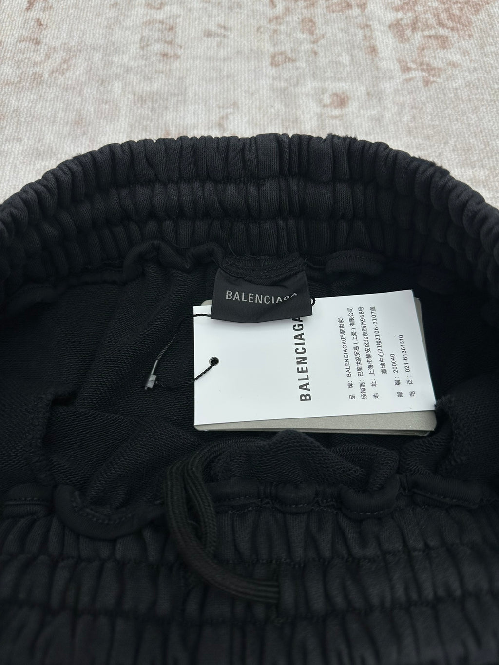 Balenciaga dark pants with interior tag and elastic waistband