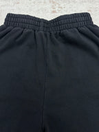 Balenciaga dark pants back view with elastic waistband and center seam