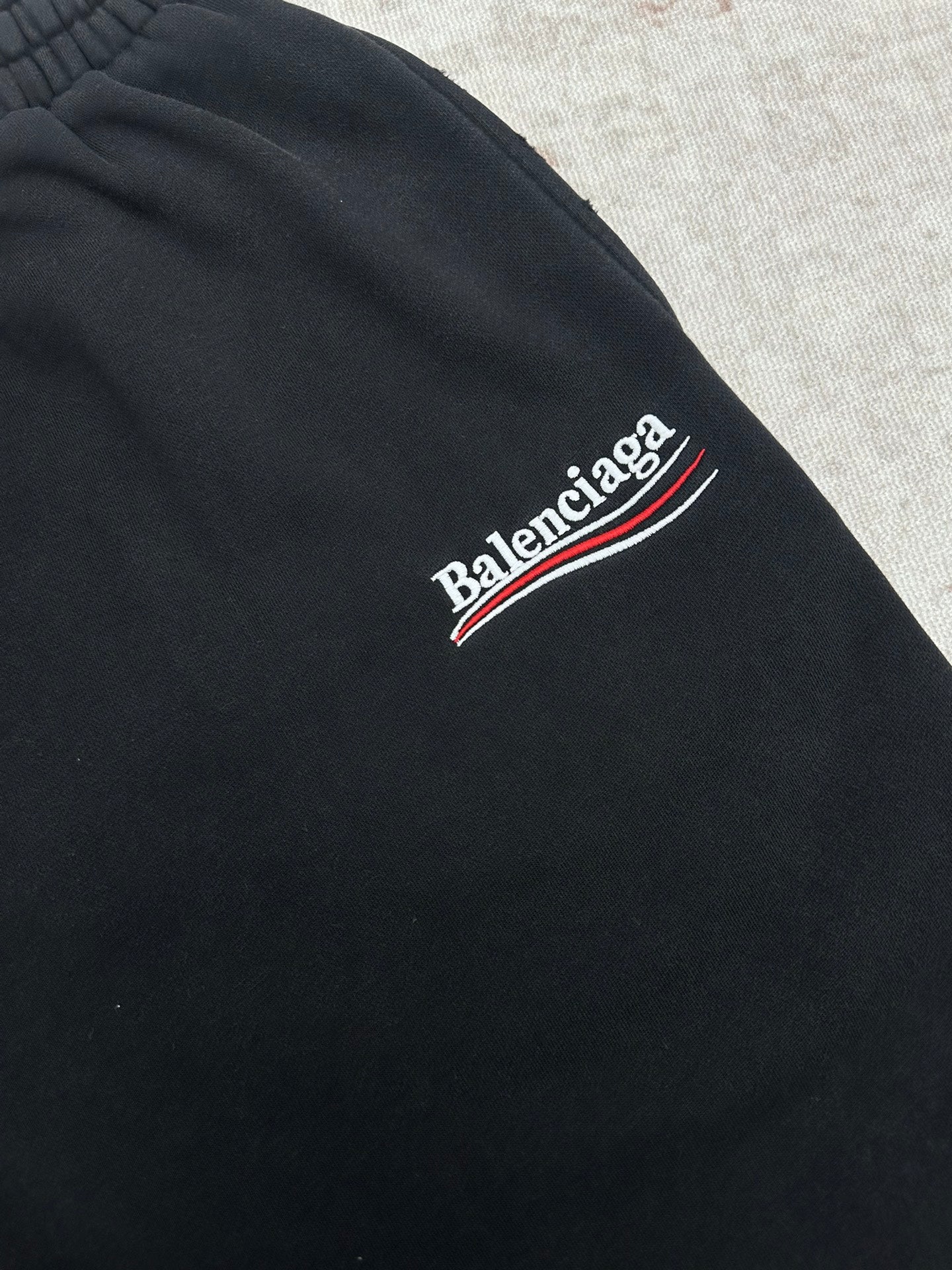Balenciaga dark pants with embroidered Balenciaga logo on side