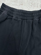 Black pants with elastic waistband and center front pleats