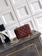 Burgundy Chanel mini quilted flap bag with gold chain crossbody strap