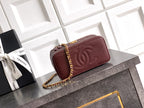 Burgundy Chanel mini quilted flap bag with CC logo and gold chain