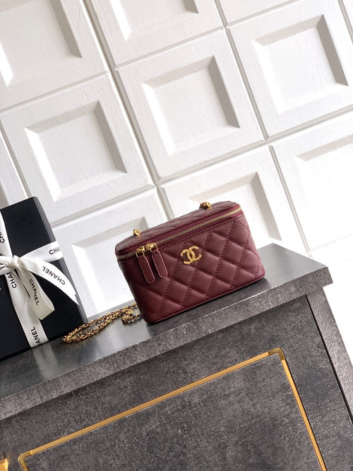 Quilted burgundy Chanel mini flap bag with gold chain crossbody strap