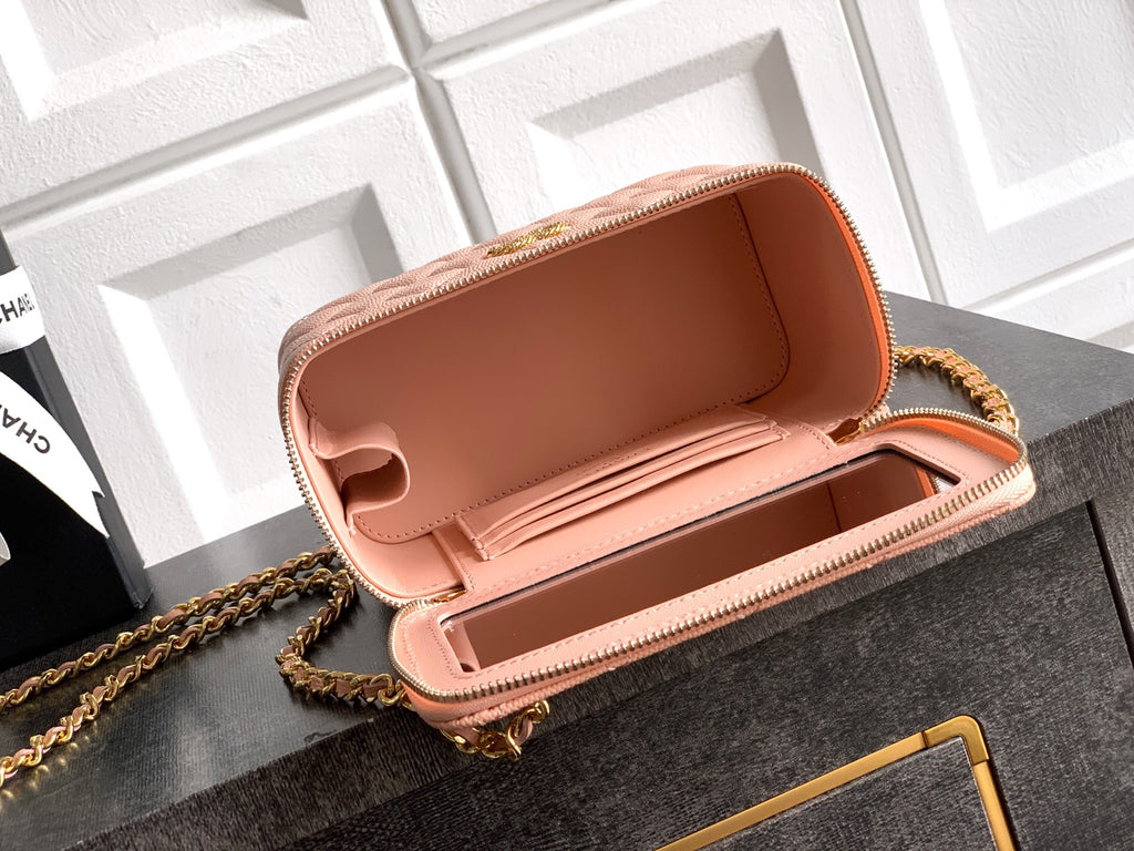 Chanel bag in light pink leather with open top and gold zipper trim