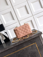 Chanel bag in light pink quilted leather with gold chain strap and front CC logo