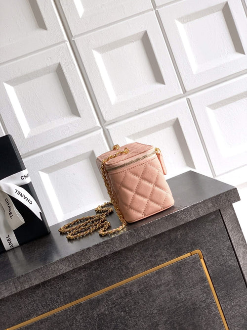 Chanel bag in light pink quilted leather with gold chain strap and small top handle