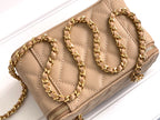 Chanel quilted mini bag top view, beige, gold chain strap and zipper edge