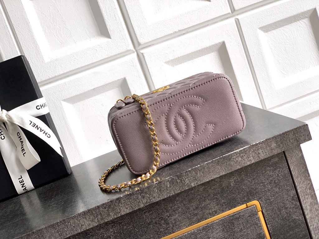 Lilac quilted Chanel mini bag with embossed CC logo and gold-tone chain
