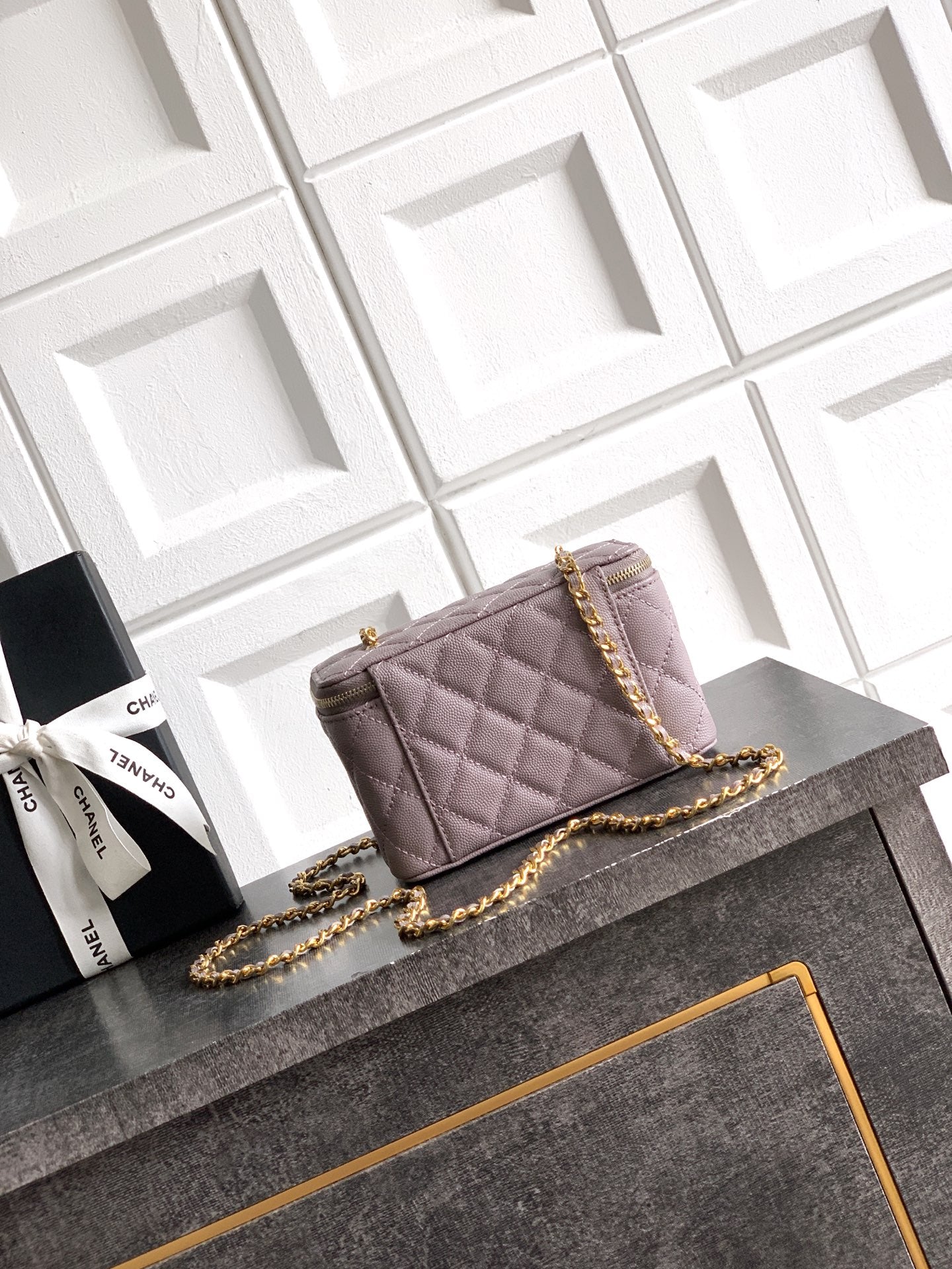 Lilac quilted mini shoulder bag with gold-tone chain strap and front flap