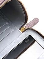 Lilac mini bag interior with card slot panels and gold-tone zipper trim