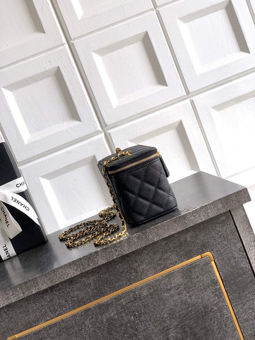 Chanel quilted leather mini bag, black, gold chain strap and front flap.