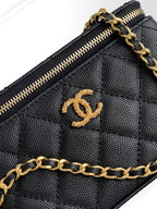 Chanel quilted mini bag interior, gold zipper and CC logo emblem on lining.