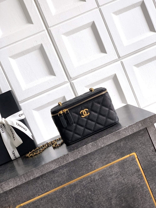 Chanel quilted leather mini bag, black, with gold-tone chain strap and CC emblem.