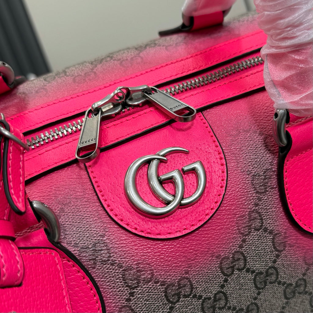 Gucci duffel bag zipper detail with pink leather trim and metal zip pulls