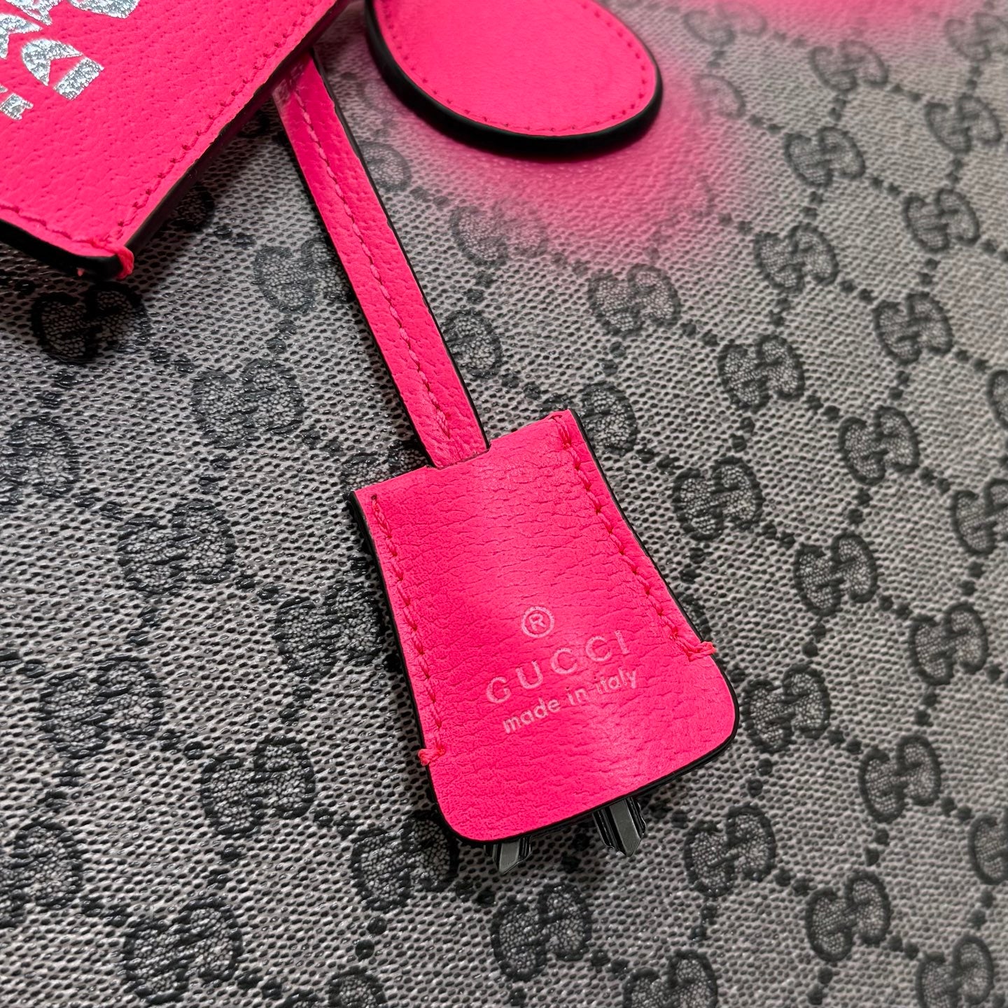 Pink leather Gucci bag key fob with logo stamp on GG-pattern canvas
