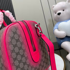 Pink Gucci bag with GG monogram canvas, leather trim, and top zipper pocket