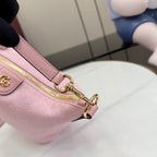 Light pink mini bag with gold zipper ring hardware and detachable strap