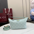Gucci shoulder bag in light blue with GG monogram canvas, gold hardware, top zip